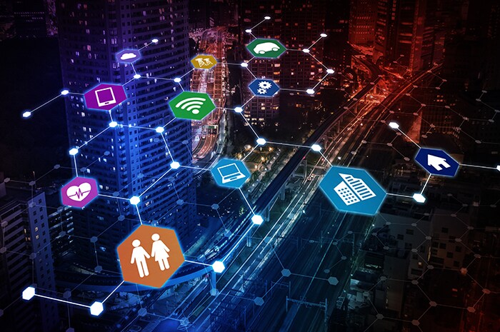 hexagons with application icons, connected by glowing lines overlaid over a city